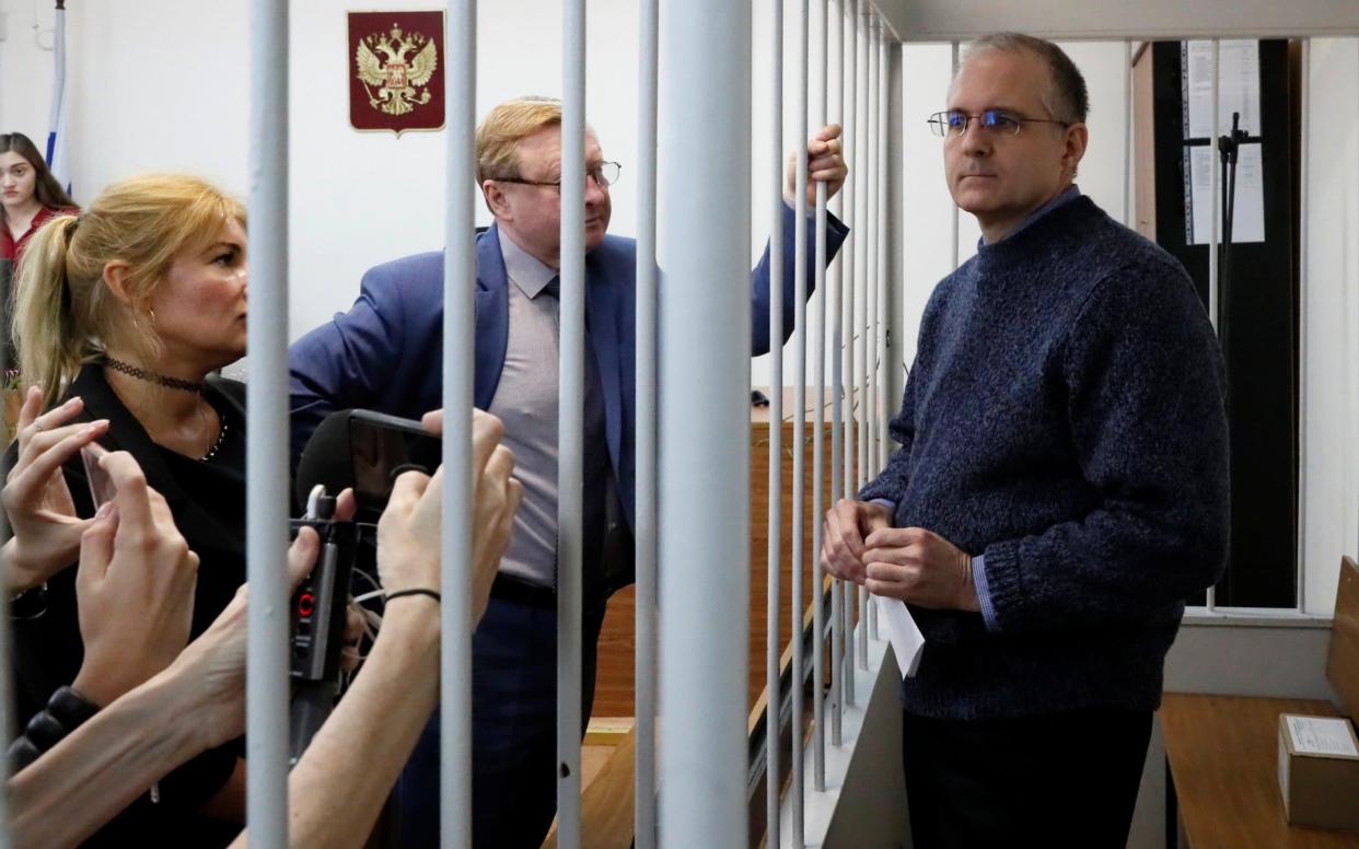 Paul Whelan stands with his lawyer Vladimir Zherebenkov in before a Moscow court extended his arrest to August - REUTERS