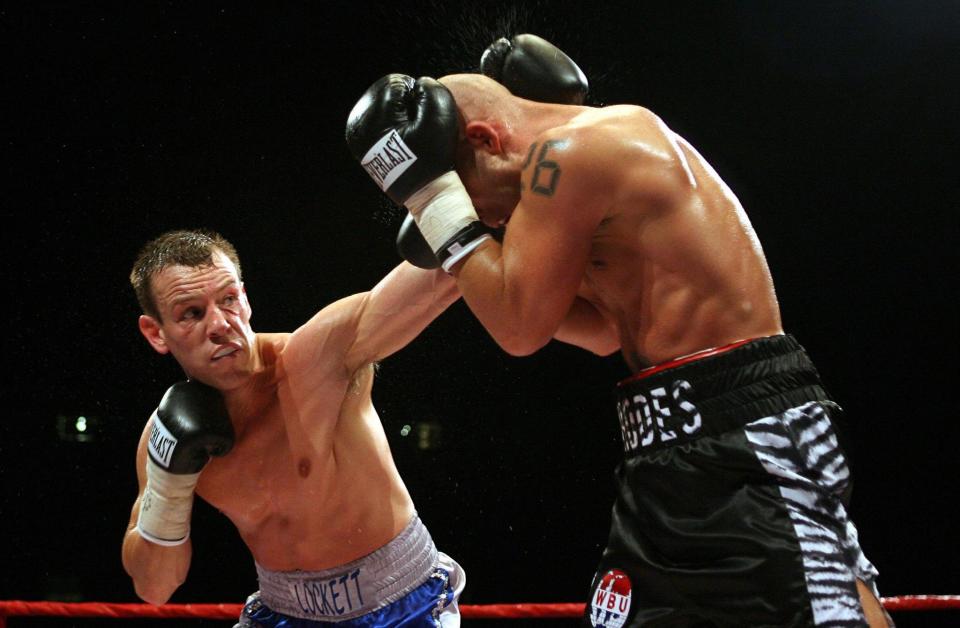 Gary Lockett (left) fires a punch at Ryan Rhodes during the for the WBU Middleweight Championship of the World at the Millennium Stadium, Cardiff.   (Photo by David Davies - PA Images/PA Images via Getty Images)