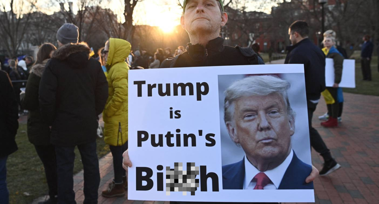 Protestor holding a sign that says 