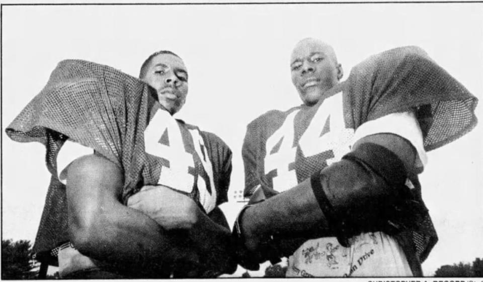 West Charlotte twin brothers Jami’h (left) and Wali Rainer anchored the Lions’ defense in the 1994 season. The brothers played in college at Virginia.