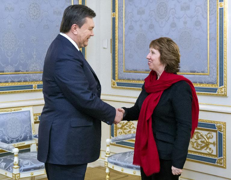 Viktor Yanukovych (left) shakes hands with EU foreign policy chief Catherine Ashton prior to their meeting in Kiev on January 29, 2014