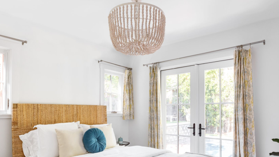 bedroom ideas, beaded light fixture above the bed