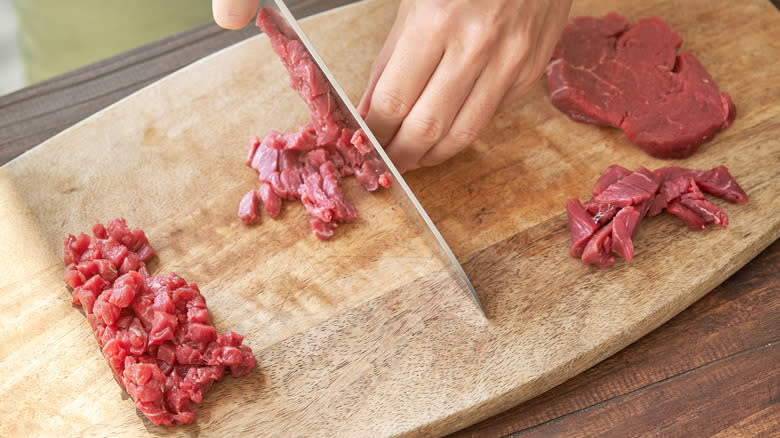 Cutting raw beef