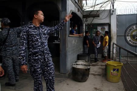 A prison personnel gestures during an interview following the escape of more than 150 inmates after gunmen stormed a prison in North Cotabato province, southern Philippines January 4, 2017. REUTERS/Dennis Jay Santos