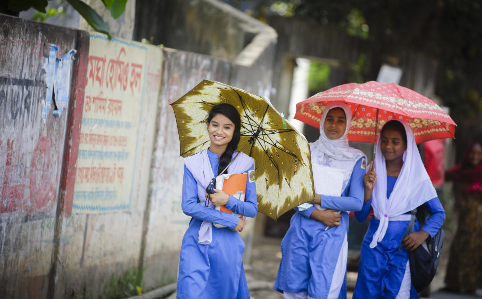 Savar, Bangladesh - April 13: Girls in school uniform walking along a road after school on April 13, 2016 in Savar, Bangladesh.&nbsp;