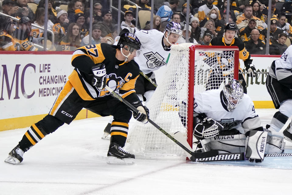 Pittsburgh Penguins' Sidney Crosby (87) can't get a shot past Los Angeles Kings goaltender Cal Petersen (40) during the second period of an NHL hockey game in Pittsburgh, Sunday, Jan. 30, 2022. (AP Photo/Gene J. Puskar)