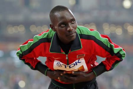 Asbel Kiprop of Kenya, gold medal, poses on the podium after the men's 1500m event during the 15th IAAF World Championships at the National Stadium in Beijing, China, August 30, 2015. REUTERS/Kim Kyung-Hoon