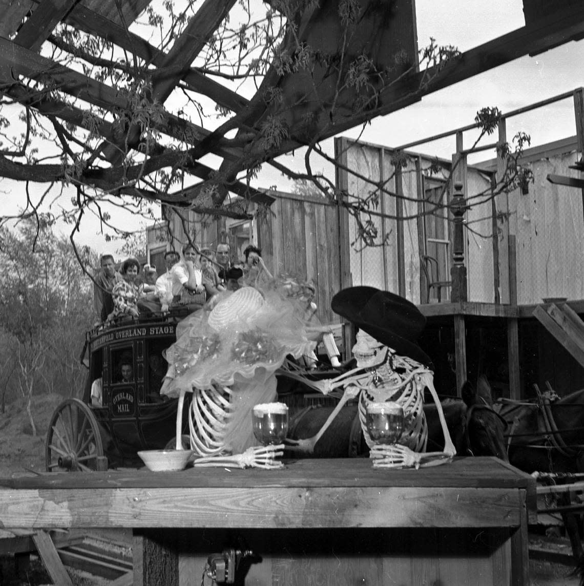 April 18, 1964: Skeletons sitting at a bar in the Western section of Six Flags Over Texas on opening day of 1964.