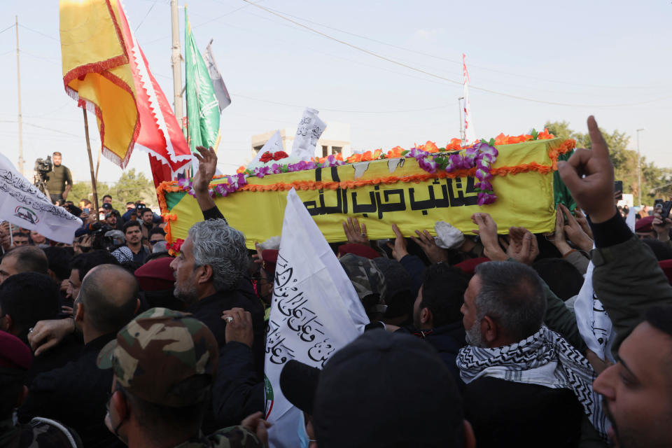 People carry a coffin of a commander from Kataib Hezbollah, who was killed in a U.S. drone strike, during a funeral in Baghdad, Iraq, Feb. 8, 2024. / Credit: Reuters/Ahmed Saad