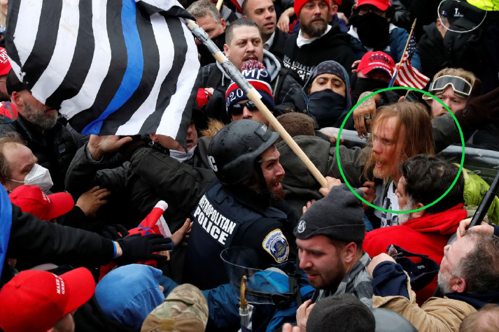 A man identified as Nathan Baer of Starnes Cove near Asheville is shown in this Department of Justice provided by Reuters photo from Jan. 6, 2021 at the U.S. Capitol. To his left is ex-District of Columbia Metropolitan Police Officer Michael Fanone, who testified before the Jan. 6 House committee.