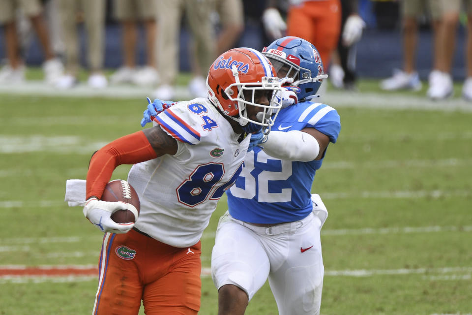 Florida tight end Kyle Pitts (84) breaks away from Mississippi linebacker Jacquez Jones (32) during the second half of an NCAA college football game in Oxford, Miss., Saturday, Sept. 26, 2020. No. 5 Florida won 51-35. (AP Photo/Thomas Graning)