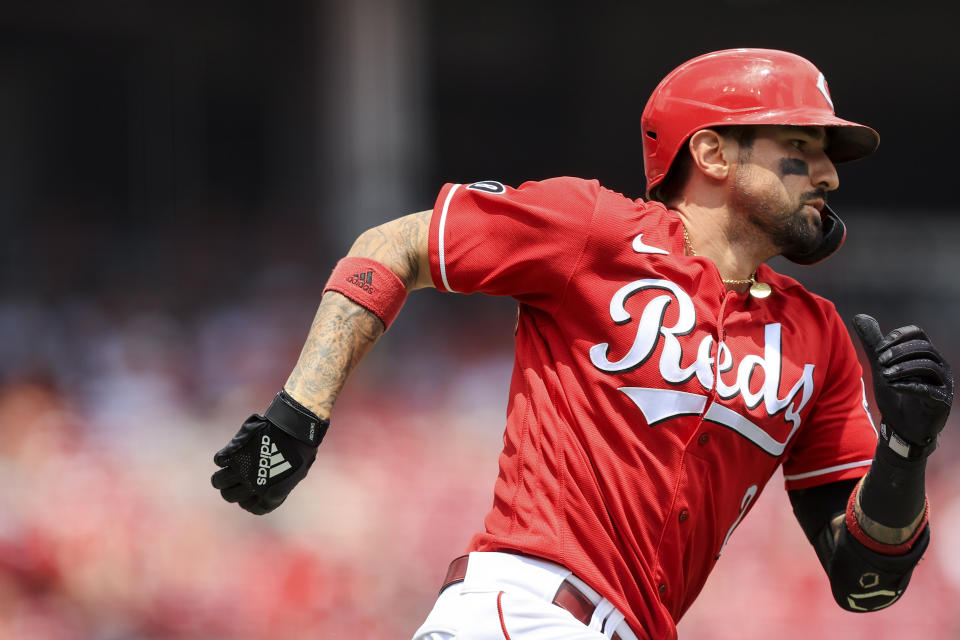 Cincinnati Reds' Nick Castellanos runs the bases after hitting a double during the third inning of a baseball game against the Colorado Rockies in Cincinnati, Sunday, June 13, 2021. (AP Photo/Aaron Doster)