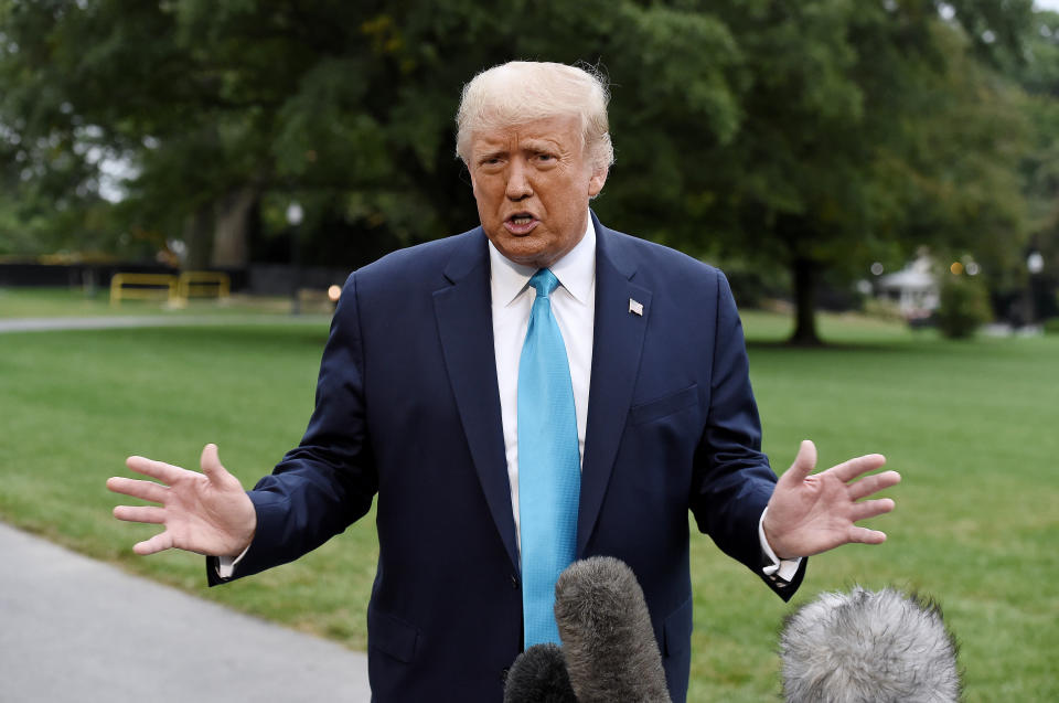 President Donald Trump speaks to reporters outside the White House on Saturday. (Photo: OLIVIER DOULIERY via Getty Images)