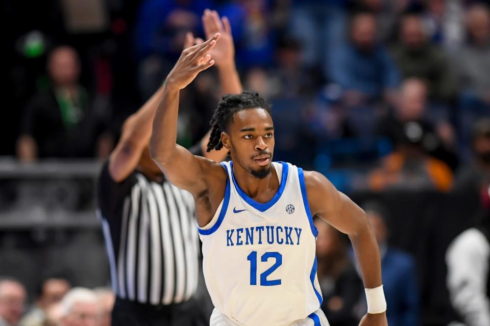 Mar 15, 2024; Nashville, TN, USA; Kentucky Wildcats guard Antonio Reeves (12) celebrates his three point basket against the Texas A&M Aggies during the first half at Bridgestone Arena. Mandatory Credit: Steve Roberts-USA TODAY Sports