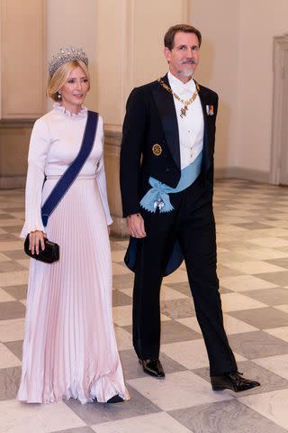 <p>Patrick van Katwijk/Getty</p> Crown Princess Marie-Chantal and Crown Prince of Greece enter Prince Christian of Denmark's birthday gala at Christiansborg Palace on October 15