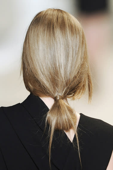 Elie Saab's Fall runway featured low knotted buns that are simple but interesting enough to be…