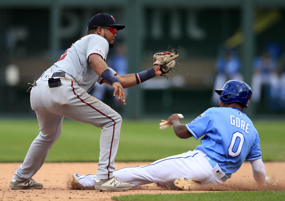 Kansas City Royals' Terrance Gore (0) beats the tag by Minnesota Twins second baseman Luis Arraez, left, during the ninth inning of a baseball game at Kauffman Stadium in Kansas City, Mo., Saturday, June 22, 2019. Gore was safe with a stolen base on the play. (AP Photo/Orlin Wagner)