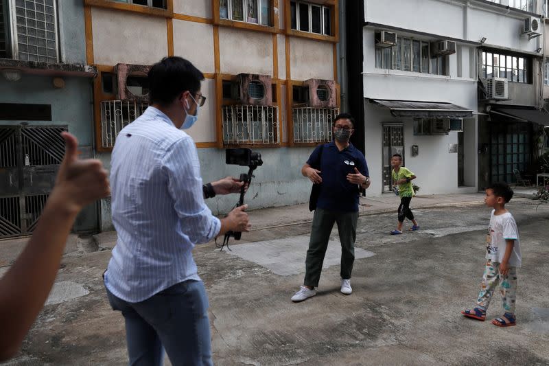 Paul Chan, tour guide and CEO of Walk in Hong Kong, and Charles Lai, architect, speak during a live streamed virtual tour, following the coronavirus disease (COVID-19) outbreak in Hong Kong