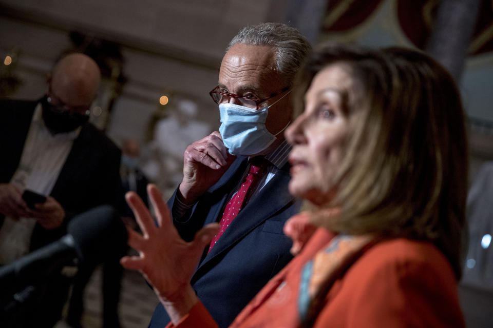 House Speaker Nancy Pelosi of Calif., right, accompanied by Senate Minority Leader Sen. Chuck Schumer of N.Y., left, speaks to members of the media after meeting with Treasury Secretary Steven Mnuchin and White House Chief of Staff Mark Meadows as they continue to negotiate a coronavirus relief package on Capitol Hill in Washington, Tuesday, Aug. 4, 2020. (AP Photo/Andrew Harnik)