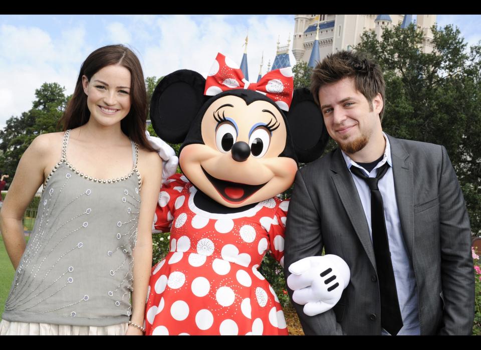 'American Idol' season nine champion Lee DeWyze (R), and his fiance, actress Jonna Walsh (L), pose with Minnie Mouse at the Magic Kingdom on July 18, 2011in Lake Buena Vista, Florida.      (Photo by Diana Zalucky/Disney Parks via Getty Images)