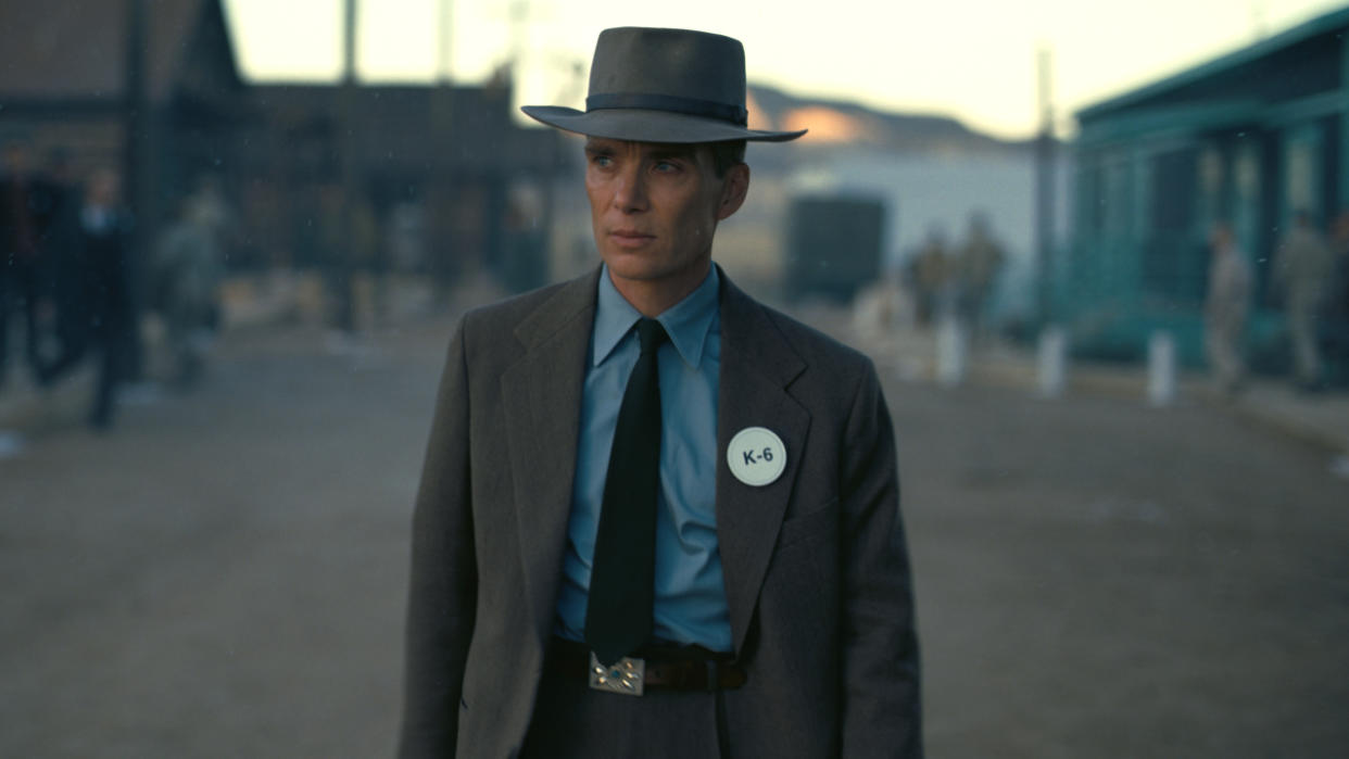  Cillian Murphy walks down a road at base camp in Oppenheimer. 