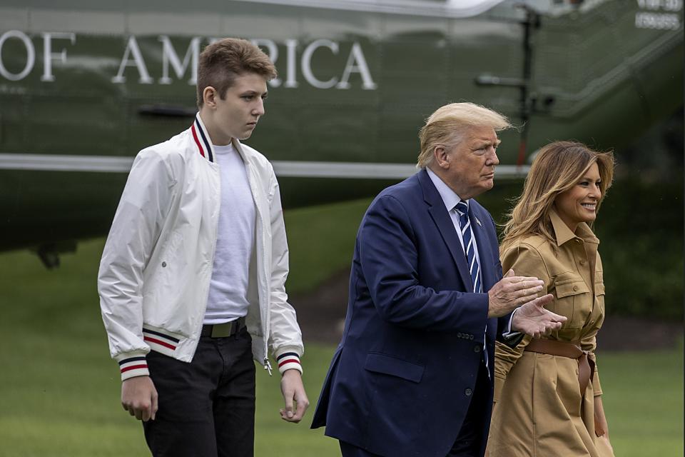 Barron Trump, US President Donald Trump and First lady Melania Trump walk on the South Lawn of the White House on August 16, 2020 in Washington, DC.