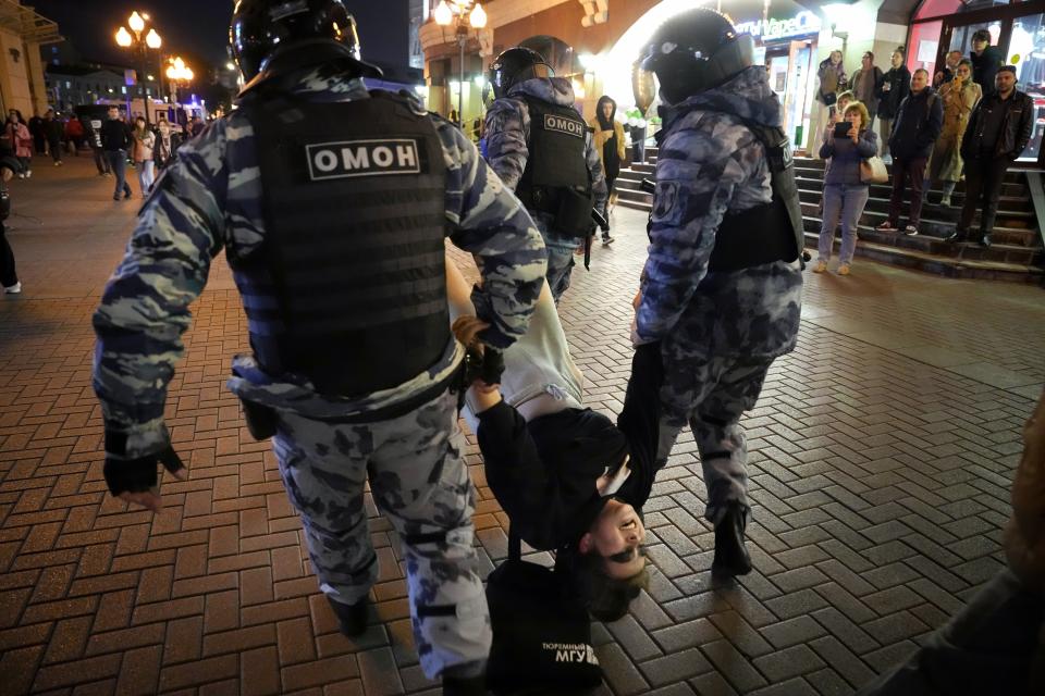 FILE - Riot police detain a demonstrator during a protest against mobilization in Moscow, Russia, Wednesday, Sept. 21, 2022. Eight months after Russian President Vladimir Putin launched an invasion against Ukraine expecting a lightening victory, the war continues, affecting not just Ukraine but also exacerbating death and tension in Russia among its own citizens. (AP Photo, File)