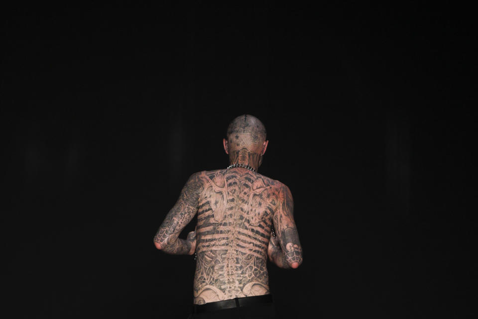 FILE - In this Saturday, June 4, 2011 file photo, Canadian model Rick Genest, aka Zombie Boy, appears on the runway during a fashion show in Rio de Janeiro, Brazil. On Friday, Aug. 3, 2018, the agency that represents Genest, known for his head-to-toe tattoos and his participation in Lady Gaga music video "Born This Way," says he has died. (AP Photo/Felipe Dana)