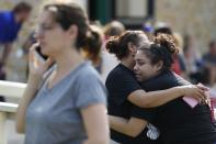 <p>Santa Fe High School junior Guadalupe Sanchez, 16, cries in the arms of her mother, Elida Sanchez, after reuniting with her at a meeting point at a nearby Alamo Gym fitness center following a shooting at Santa Fe High School in Santa Fe, Texas, on Friday, May 18, 2018. (Photo: Michael Ciaglo/Houston Chronicle via AP) </p>