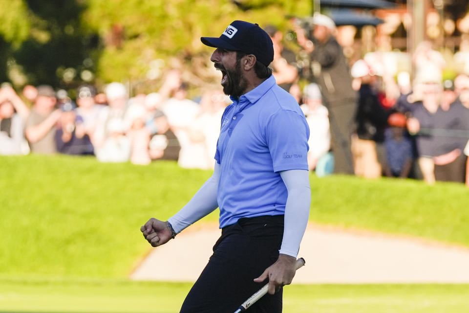 Matthieu Pavon celebrates on the 18th green of the South Course at Torrey Pines after winning the Farmers Insurance Open golf tournament, Saturday, Jan. 27, 2024, in San Diego. (AP Photo/Gregory Bull)