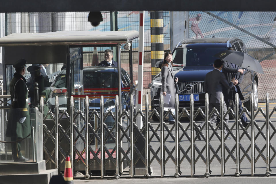 A car, left, carrying North Korean senior ruling party official and former intelligence chief Kim Yong Chol, prepares to leave from the VIP terminal of the Beijing International airport in Beijing Thursday, Jan. 17, 2019. (AP Photo/Ng Han Guan)