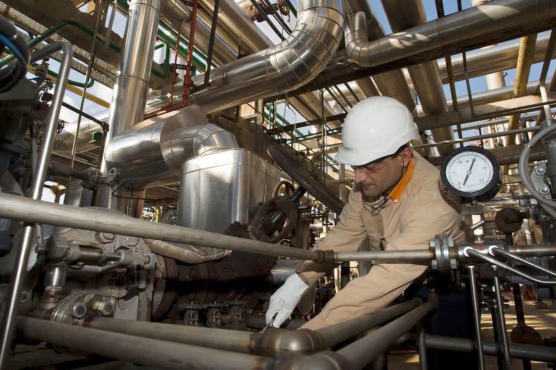 FILE PHOTO: Employee works at Repsol YPF's refinery plant in Cartagena