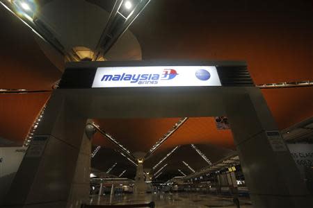 The Malaysia Airlines logo is seen at the main entrance at Kuala Lumpur International Airport in Sepang outside Kuala Lumpur April 21, 2014. REUTERS/Samsul Said