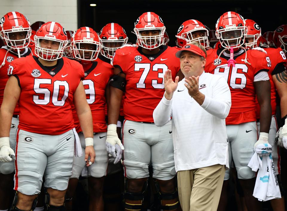 Oct 29, 2022; Jacksonville, Florida, USA; Georgia Bulldogs head coach Kirby Smart and players get ready to run out of the tunnel against the Florida Gators at TIAA Bank Field. Kim Klement-USA TODAY Sports