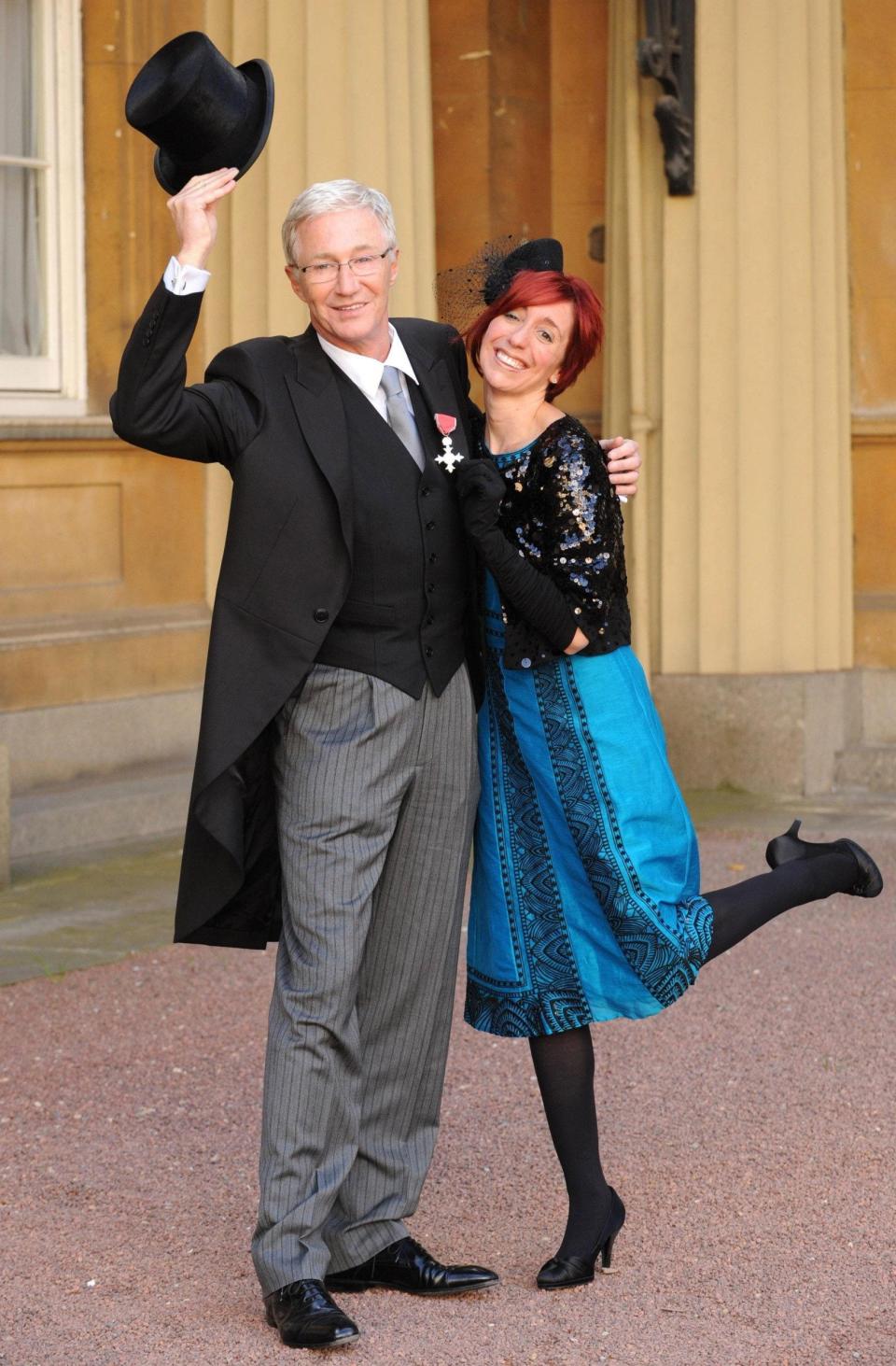 With his daughter Sharyn at Buckingham Palace following his appointment as MBE - Fiona Hanson/PA Wire