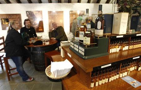 Bottles of whisky are displayed in the visitor centre of the Diageo-owned Dalwhinnie Distillery in Dalwhinnie in the Scottish Highlands May 16, 2011. REUTERS/David Moir