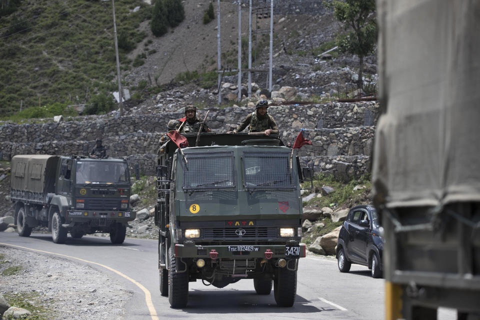 An Indian army convoy moves on the Srinagar- Ladakh highway at Gagangeer, north-east of Srinagar, India, Wednesday, June 17, 2020. Indian security forces said neither side fired any shots in the clash in the Ladakh region late Monday that was the first deadly confrontation on the disputed border between India and China since 1975. China said Wednesday that it is seeking a peaceful resolution to its Himalayan border dispute with India following the death of 20 Indian soldiers in the most violent confrontation in decades. (AP Photo/Mukhtar Khan)