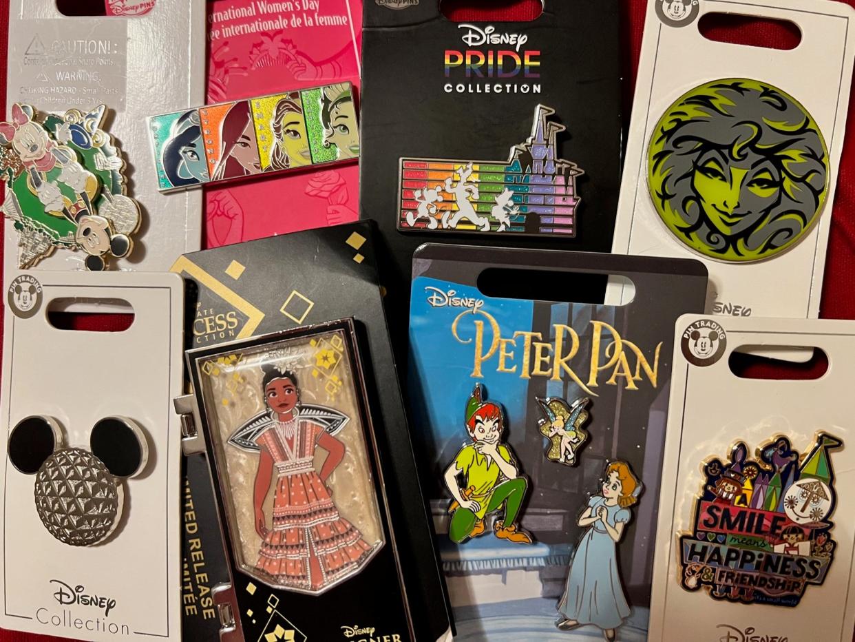Fans collect pins of their favorite characters and Disney landmarks.