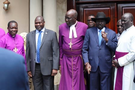 South Sudan Council of Churhes chair Reverend Peter Gai stands with President Salva Kiir Mayardit and ex-vice president and former rebel leader Riek Machar before their meeting in Juba, South Sudan