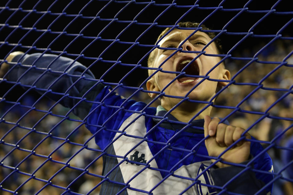 A fan of Argentina's Velez Sarsfield cheers prior a Copa Libertadores semifinal first leg soccer match against Brazil's Flamengo at Jose Almafitani stadium in Buenos Aires, Argentina, Wednesday, Aug.31, 2022. (AP Photo/Gustavo Garello)