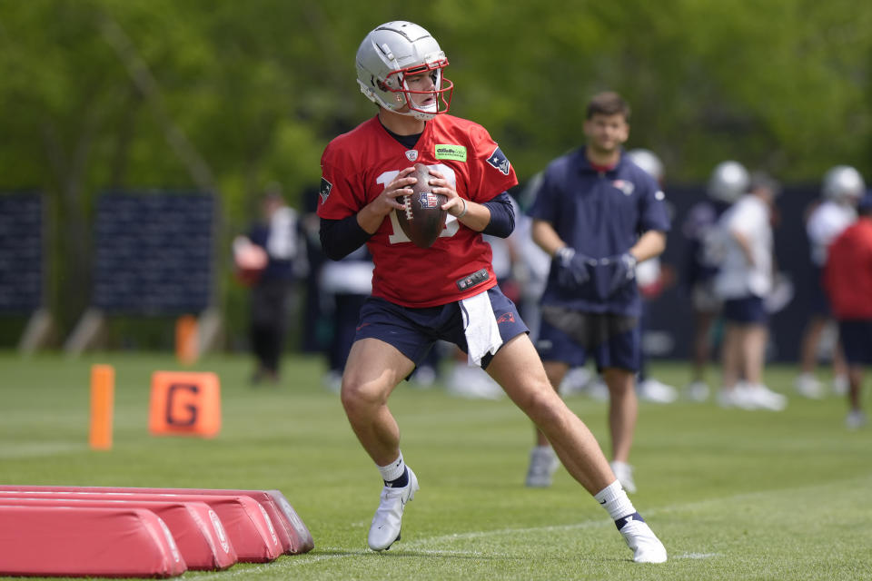 New England Patriots quarterback Drake Maye performs drills during an NFL football practice, Monday, May 20, 2024, in Foxborough, Mass. (AP Photo/Steven Senne)