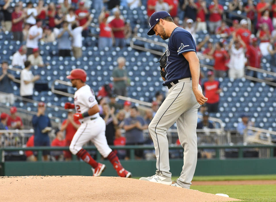 Tampa Bay Rays starting pitcher Rich Hill (14) reacts after giving up a home run to Washington Nationals left fielder Kyle Schwarber (12) during the first inning at Nationals Park. Mandatory Credit: Brad Mills-USA TODAY Sports