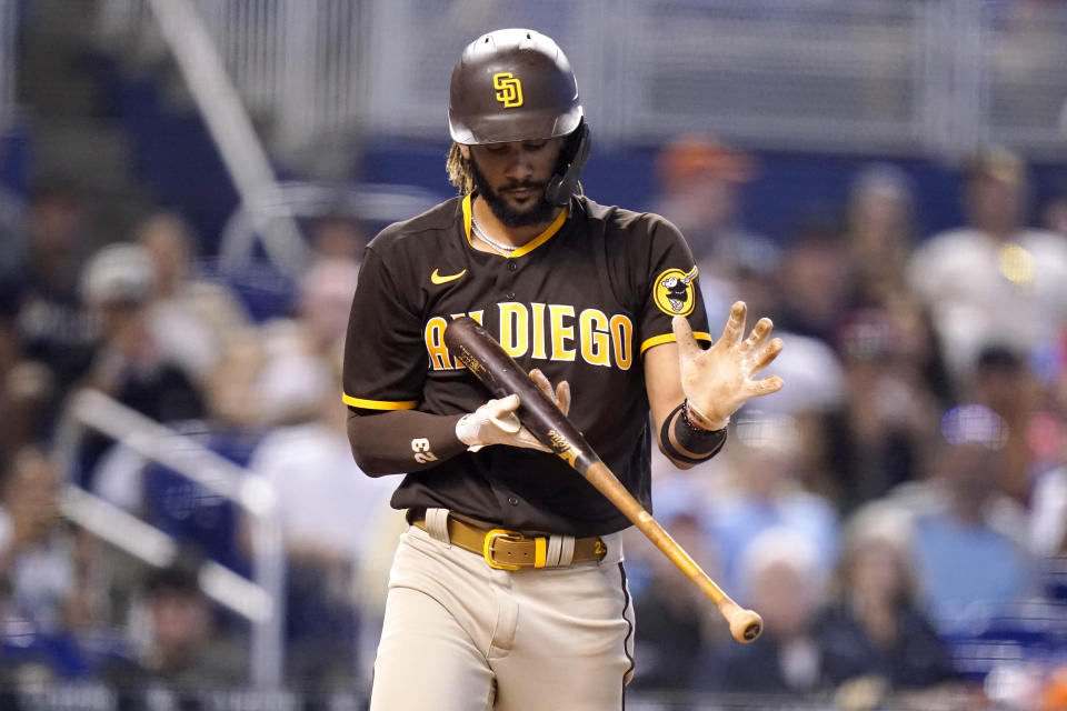 San Diego Padres' Fernando Tatis Jr. reacts after striking out during the eighth inning of a baseball game against the Miami Marlins, Sunday, July 25, 2021, in Miami. (AP Photo/Lynne Sladky)