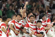 Japan's players celebrate after winning over Ireland during the Rugby World Cup Pool A game at Shizuoka Stadium Ecopa between Japan and Ireland in Shizuoka, Japan, Saturday, Sept. 28, 2019. (AP Photo/Eugene Hoshiko)