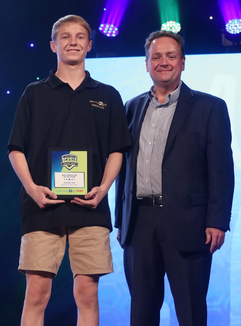 Wadsworth High's Jaxon Joy Greater Akron Wrestling Player of the Year with Michael Shearer Akron Beacon Journal editor at the High School Sports All-Star Awards at the Civic Theatre in Akron on Friday.