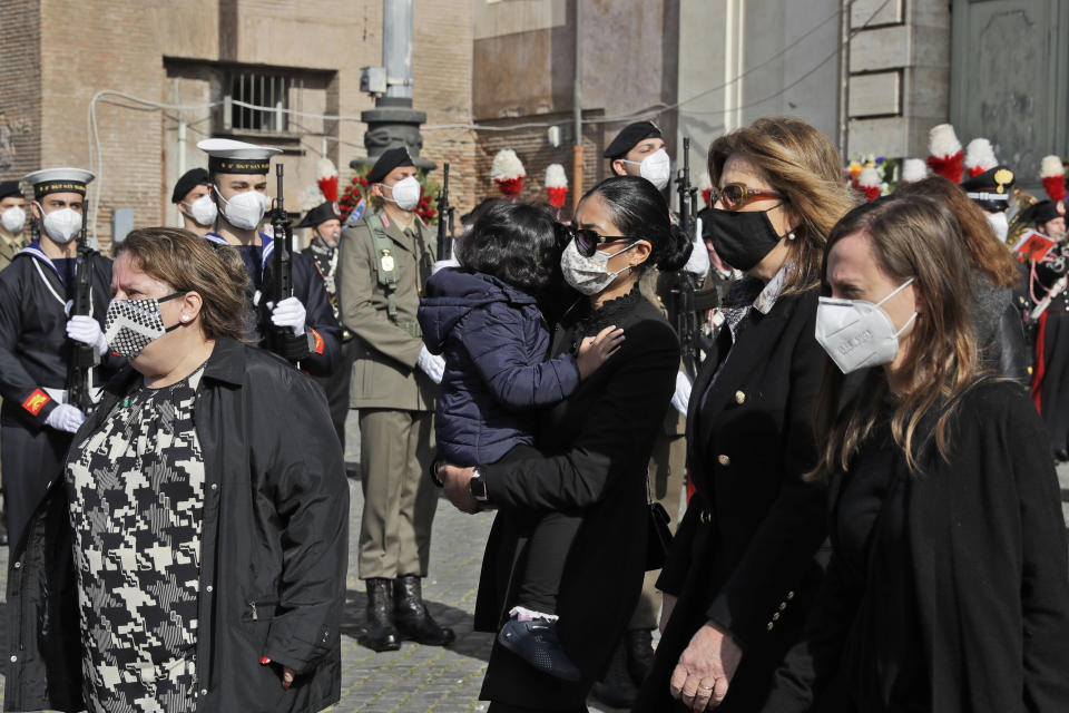 Relatives of the Italian ambassador to the Democratic Republic of Congo Luca Attanasio, including his wife Zakia Seddiki, center, walk out of Santa Maria degli Angeli Church after the state funeral of Attanasio and Italian Carabinieri police officer Vittorio Iacovacci, in Rome, Thursday, Feb. 25, 2021. Italy is pressing the United Nations for answers about the attack Monday on a U.N. food aid convoy in Congo that left the young ambassador and his paramilitary police bodyguard dead. (AP Photo/Andrew Medichini)