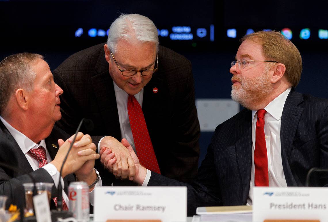 N.C. State Chancellor Randy Woodson shakes hands with UNC System President Peter Hans following a committee meeting on Wednesday, Jan. 24, 2024, in Raleigh, N.C.