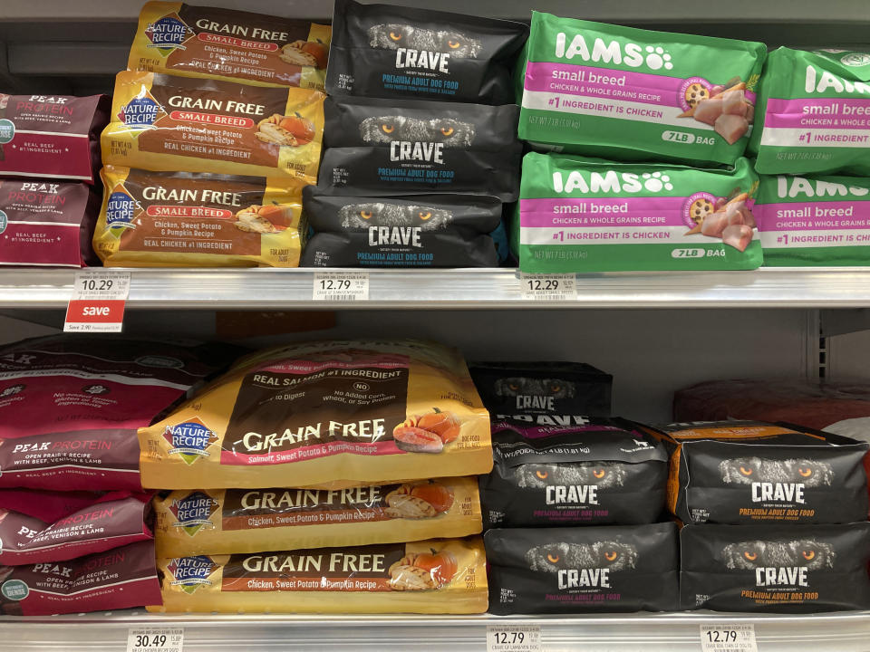 Bags of dog food are displayed at a supermarket Tuesday, July, 19, 2022, in Miami, Fla. In 2018, the FDA began investigating whether the increasing popularity of grain-free dog foods had led to a sudden rise in a potentially fatal heart disease in dogs. Four years later, the FDA has reached no conclusion, but the publicity surrounding the issue has shrunk the once-promising market for grain-free dog foods. (AP Photo/Marta Lavandier)