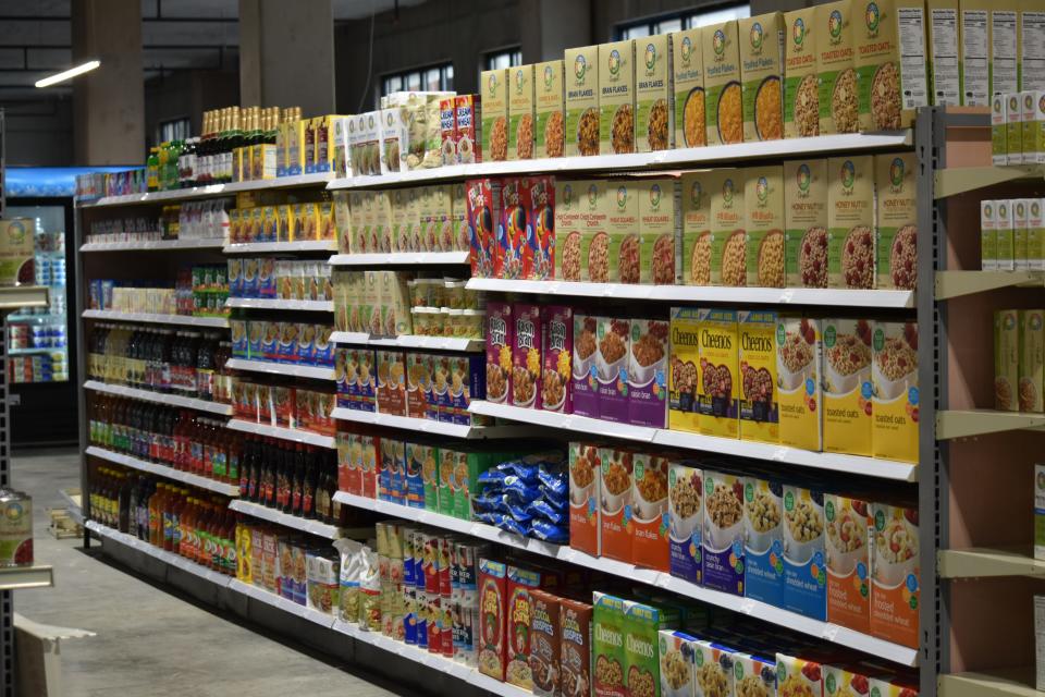 Popular cereal and snack brands intermingle with private label goods on the shelves of East Race Market.