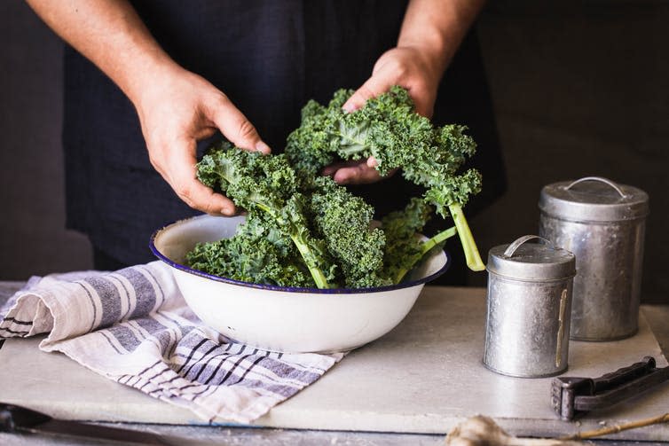 <span class="caption">Wahls’ diet included big servings of leafy green vegetables, rich in vitamins and minerals.</span> <span class="attribution"><a class="link " href="https://www.shutterstock.com/image-photo/kale-leafy-greens-vegetable-box-hold-714610834?src=WZ3pHEy1B-GAzAzp6V6eug-1-21&studio=1" rel="nofollow noopener" target="_blank" data-ylk="slk:Shutterstock;elm:context_link;itc:0;sec:content-canvas">Shutterstock</a></span>